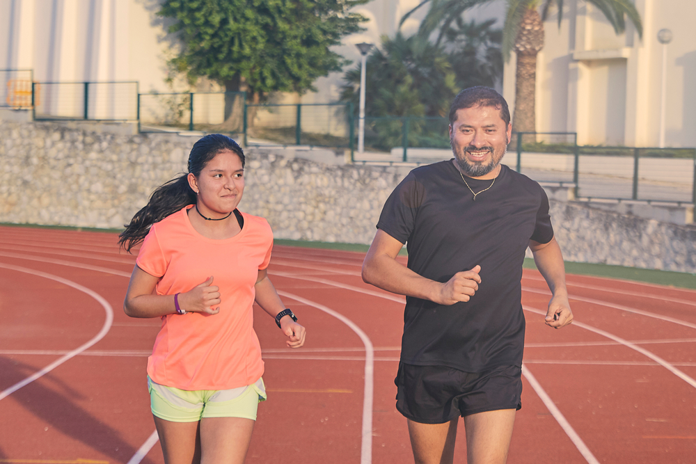 father running with daughter